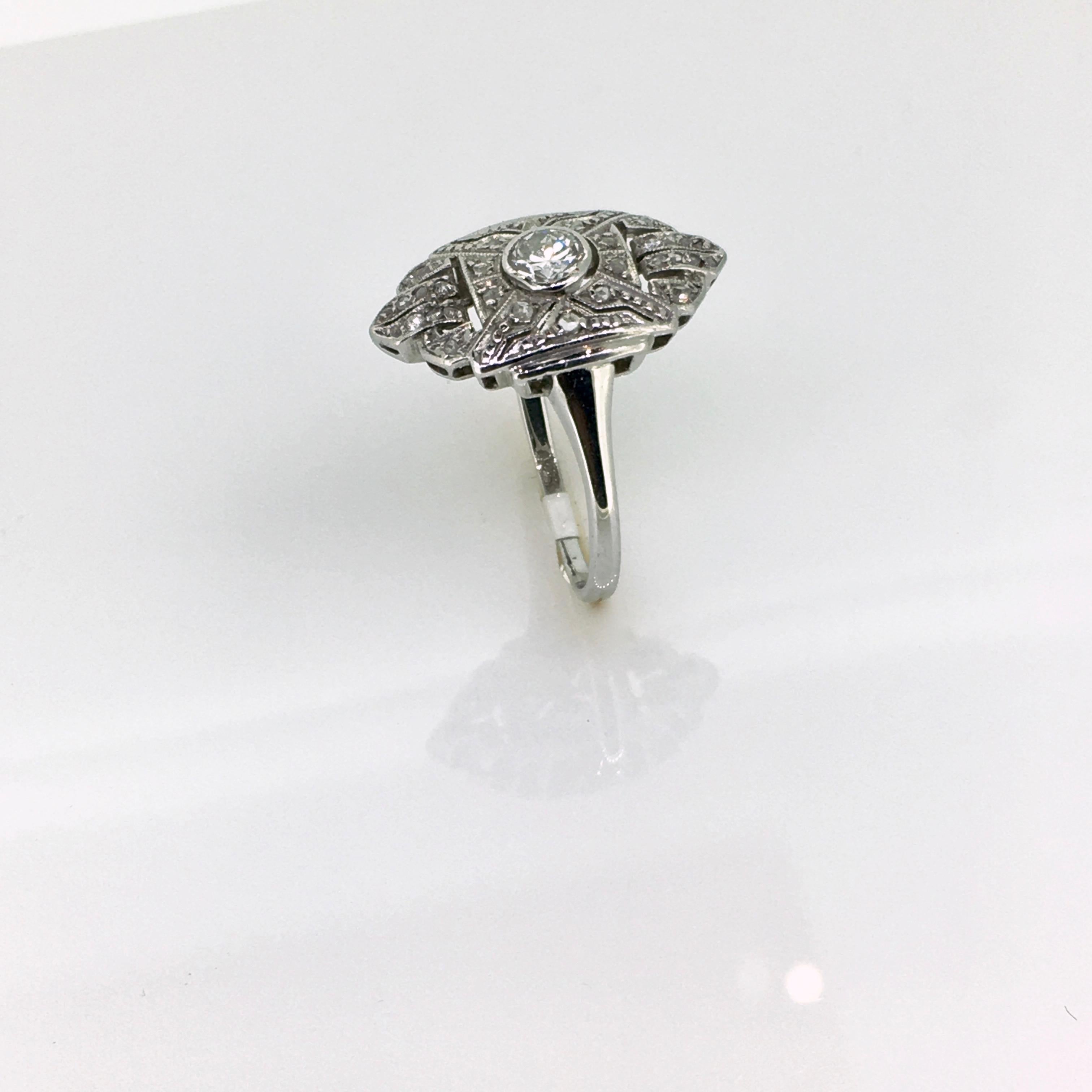 Original Art Deco ring, in 14 carat white gold, set with diamonds. Complete in original condition.
This early Art Deco ring is set with 1 centre diamond, old European cut and 30 old mine cut diamonds. 
An affordable Art Deco ring in original