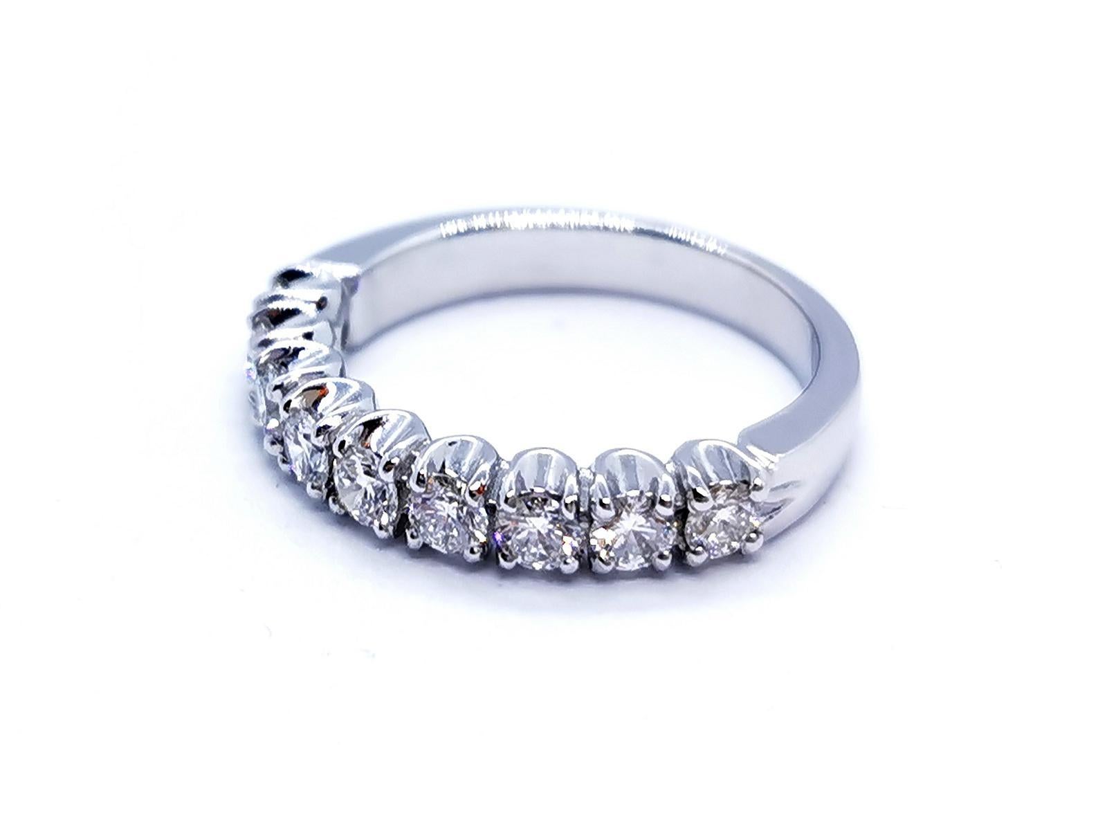 Half white gold ring 750 mils (18 carats). set with 9 brilliant-cut diamonds to F-VS 0.81 ct total prong. ring size: 52. width: 0.36 cm. total weight: 4. 69 g. punch eagle's head. new state
