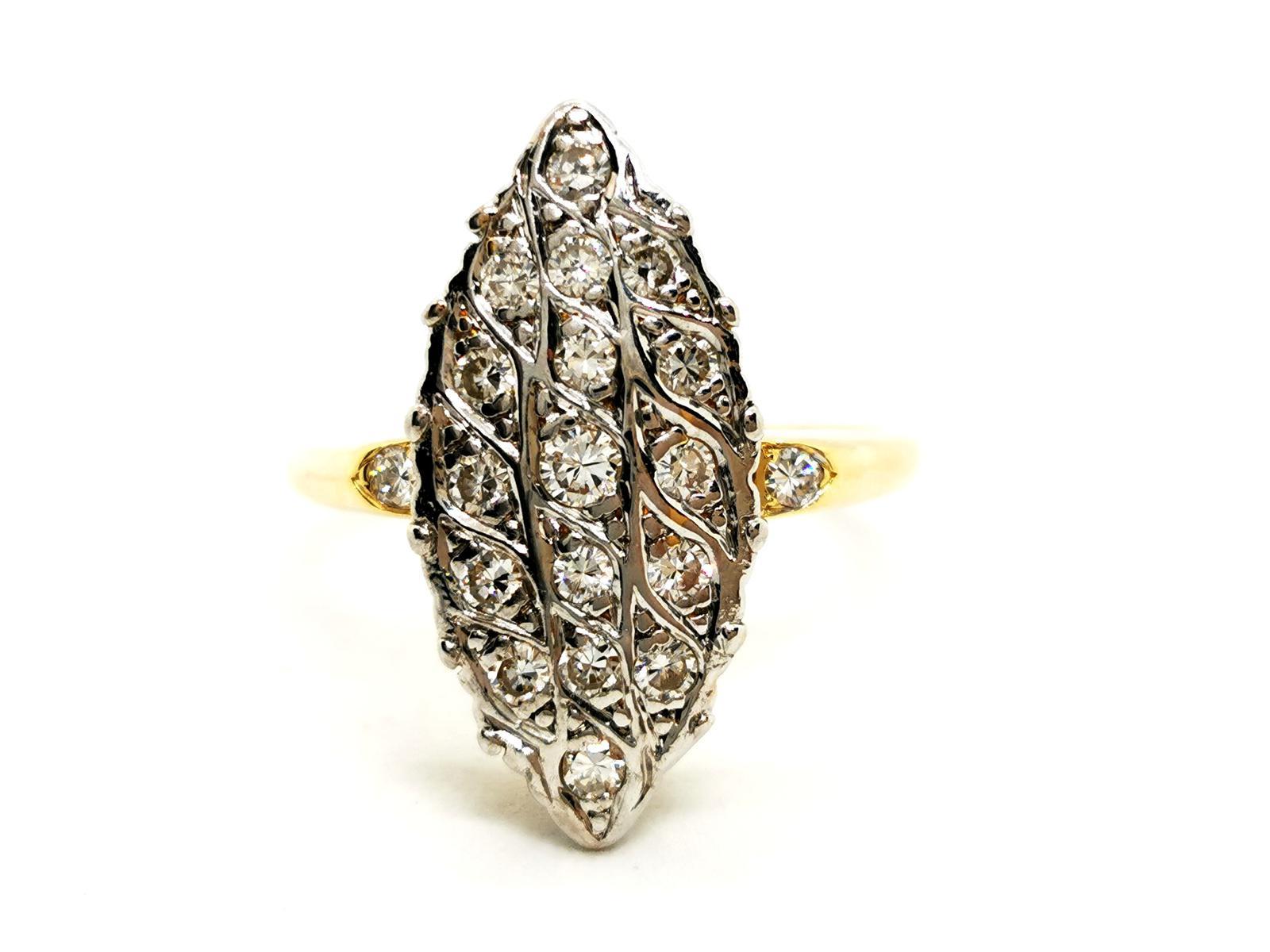 Marquise ring in white and yellow gold 750 thousandths (18 carats) set with a diamond paving of 17 diamonds. Total estimated diamond's weight: 0.51 carats. Ring's total weight: 5.90 g. Finger's size: 53.5. Upside width: 2.13 cm. Owl hallmark.