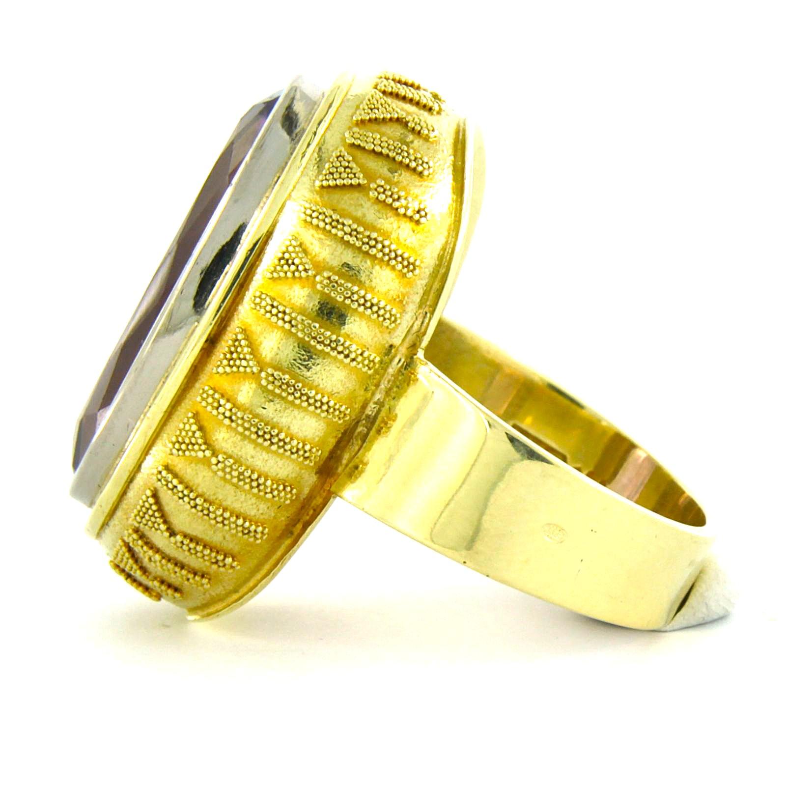 14k yellow gold ring set with amethyst - ring size US 7.5 - EU 17.75 (56)

detailed description:

the top of the ring is 2.7 cm wide by 9.4 mm high

weight 12.8 grams

ring size US 7.5 - EU 17.75 (56), ring can be enlarged or reduced a few sizes at