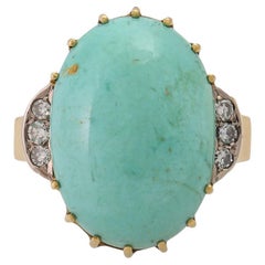 Anello con turchese ovale affiancato da 6 diamanti ottagonali