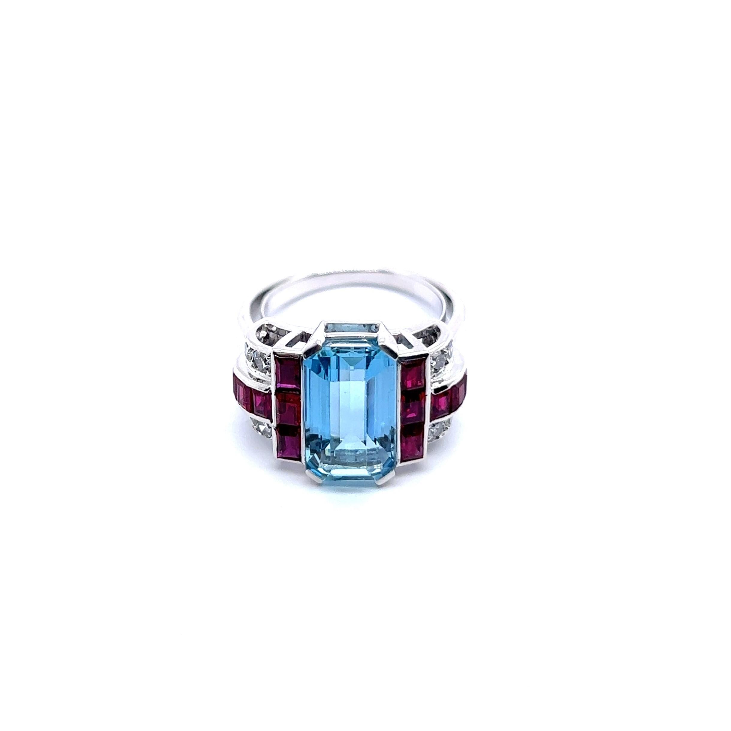 Presenting an exceptional Art Deco-style ring in 18 Karat white gold, adorned with a unique combination of aquamarine, rubies, and diamonds.

This exquisite creation is the work of Gübelin, a renowned Swiss jeweler with a remarkable legacy spanning