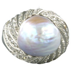 Ring with barok pearl  and diamonds 18k white gold
