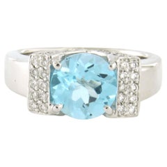 Anillo con topacio azul y diamantes talla brillante de hasta 0,60 ct Oro de 14k 11,0 gramos