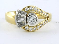 Ring with brilliant and taper cut diamonds up to 0.75ct 18k gold 7.2 grams