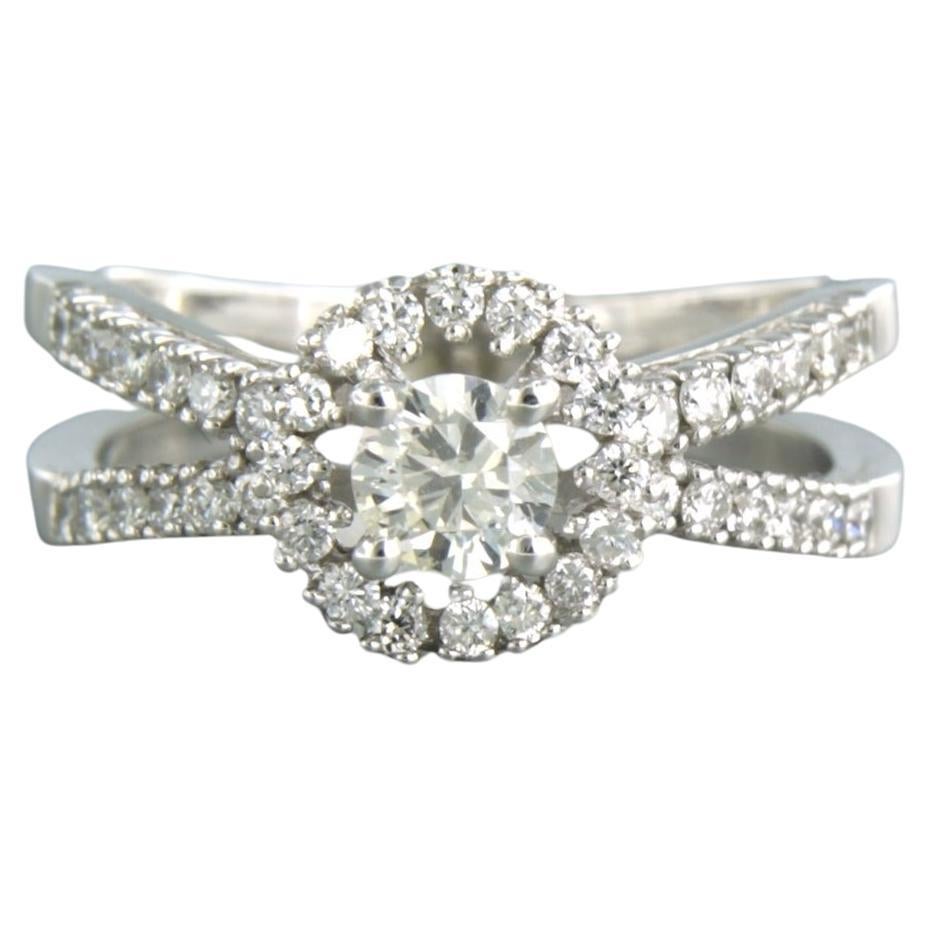 Ring with brilliant cut diamonds up to 0.71ct 14k white gold For Sale