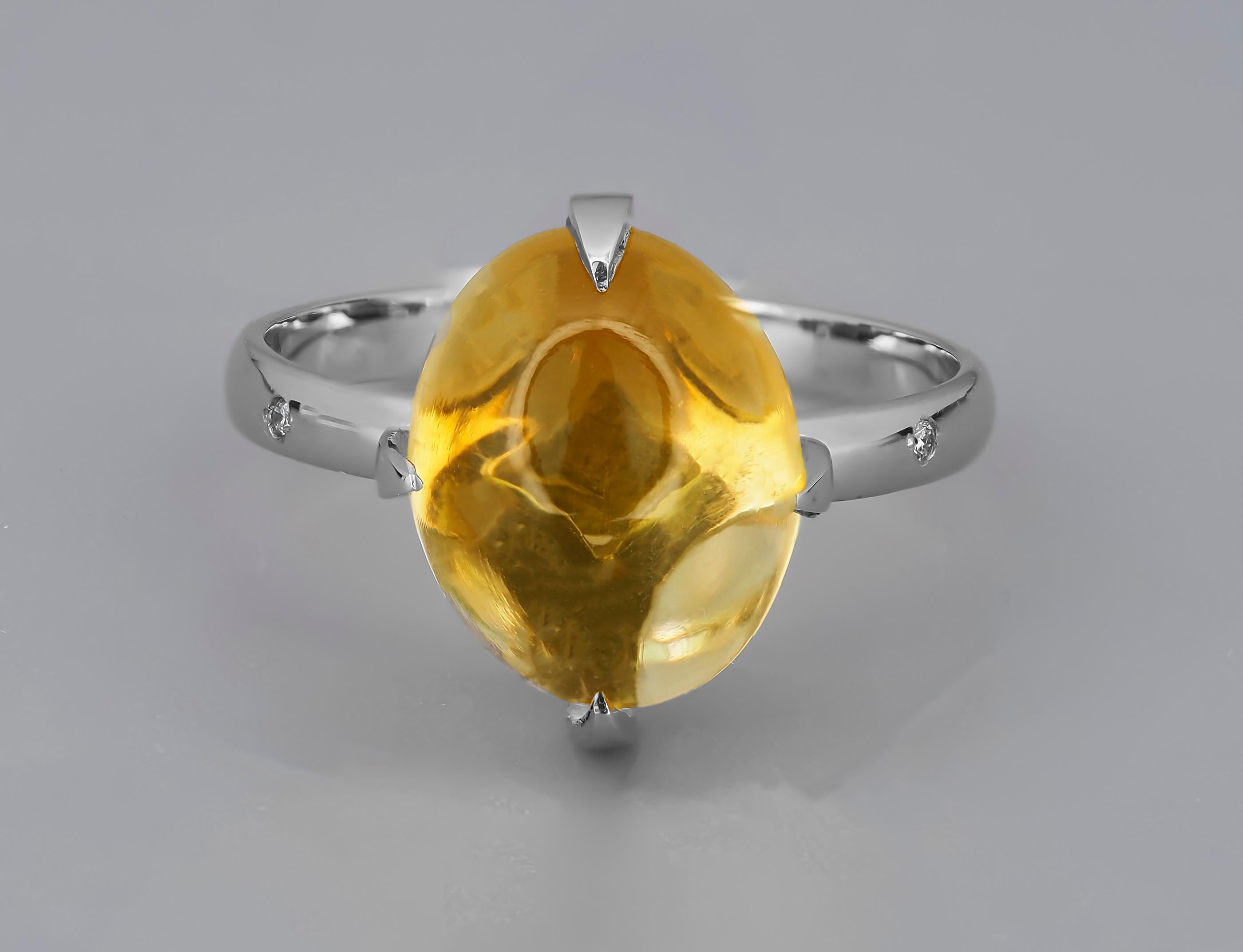 Ring with citrine cabochon and diamonds. 

Genuine citrine ring. Citrine cabochon ring. Novemver birthstone ring.

Metal: sterling silver 
Weight: 3 g depends from sizr

Set with citrine.
4.9ct. oval cabochon cut
Colour: Yellow
Clarity: