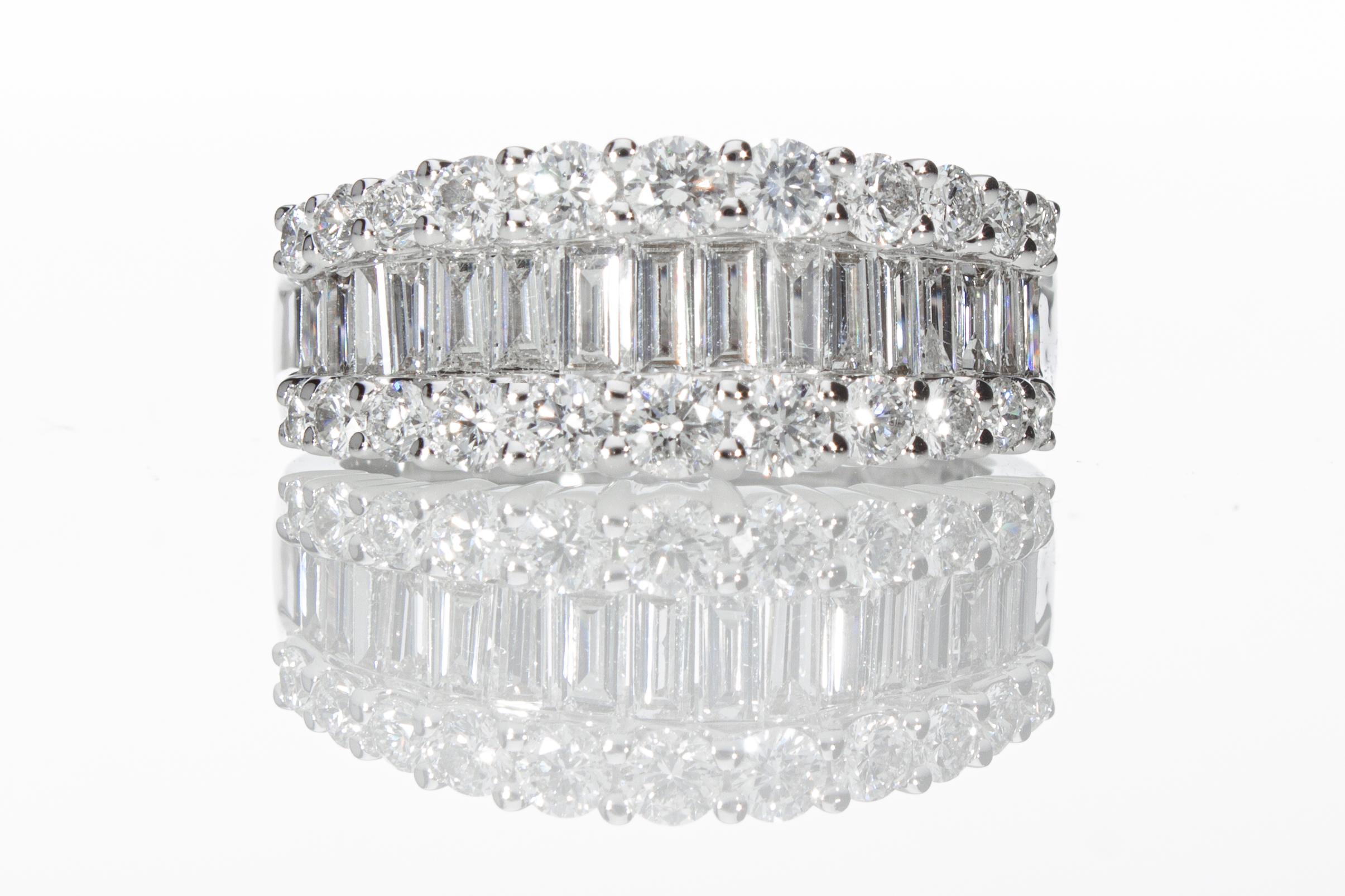 The ring is a graduated band model with 16 baguette-cut diamonds and 22 brilliant-cut diamonds. 
Total weight of the diamonds ct 1.60. 
The ring is in 18 Kt white gold.
Total Carat: ct 1.60
Total Weight: 5.4 grams
Number of Diamonds: N° 38

Ring
