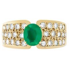 Ring with deep green oval cut emerald apprrox 0.75 carat emerald
