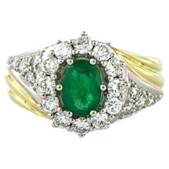 Ring with emerald and brilliant cut diamonds up to 0.92ct 14k bicolour gold