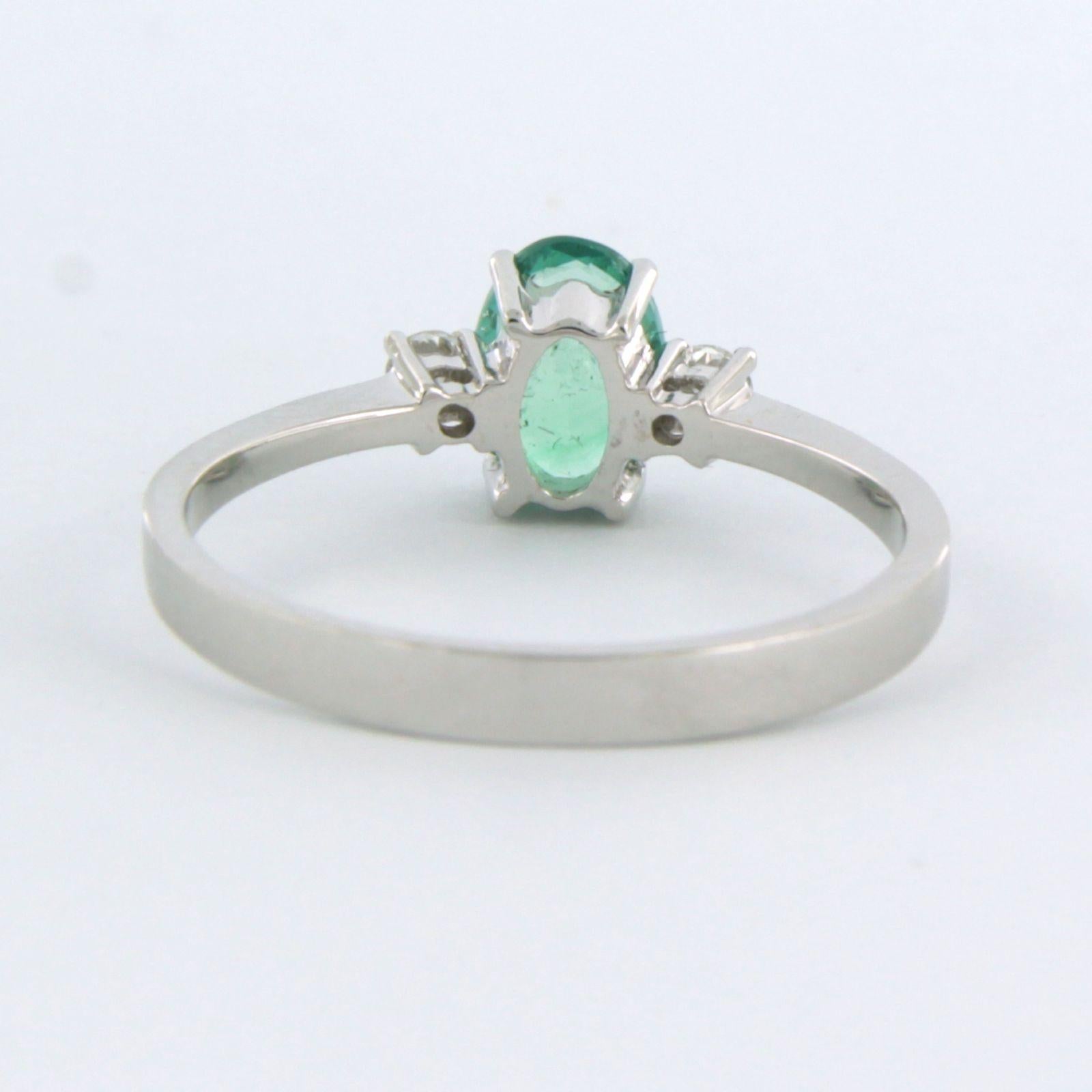 Oval Cut Ring with emerald and diamonds 18k white gold For Sale