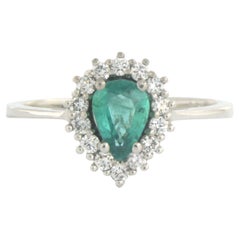 Ring with emerald and diamonds 18k white gold