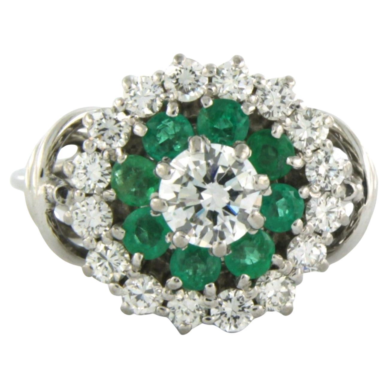 Ring with emerald and diamonds 18k white gold