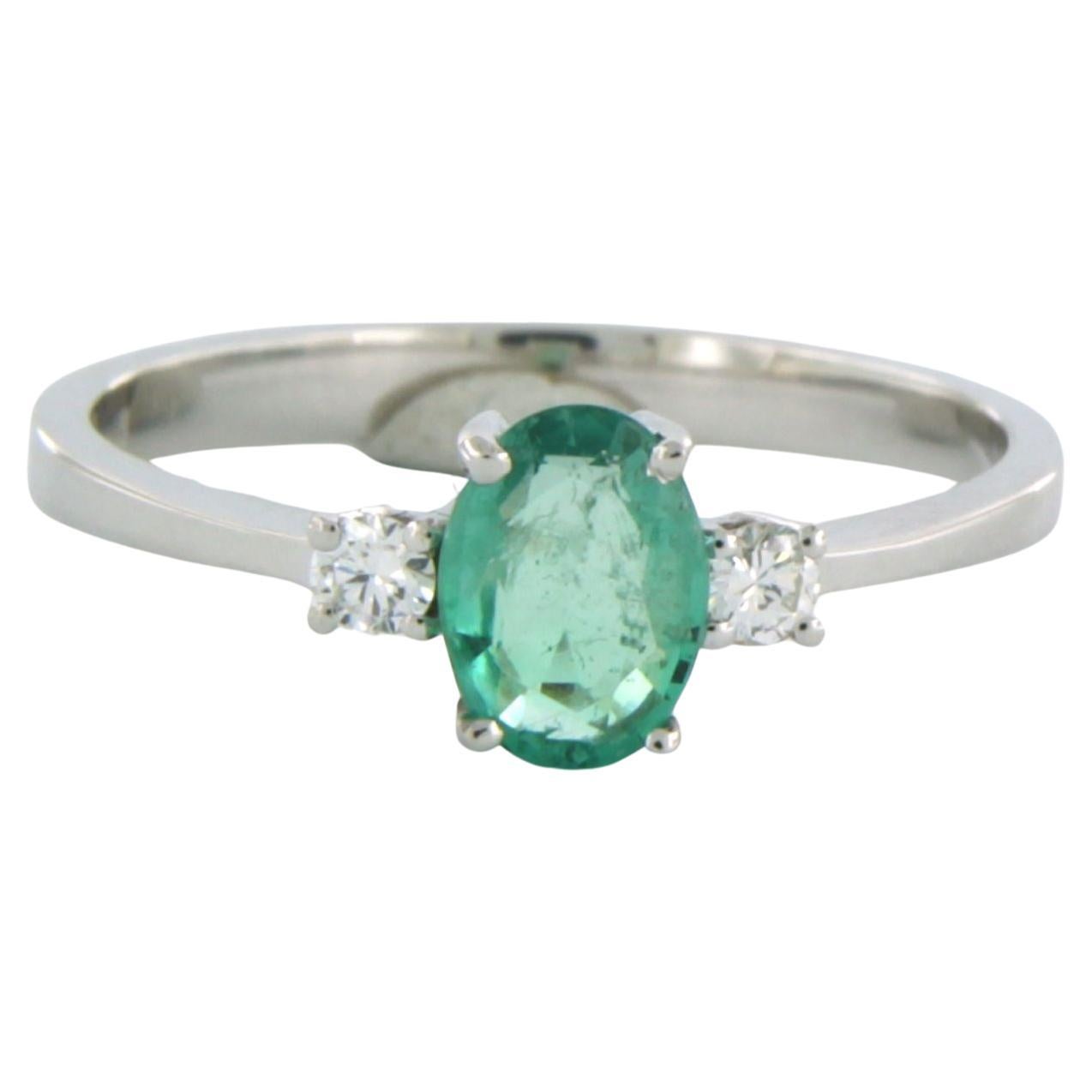 Ring with emerald and diamonds 18k white gold