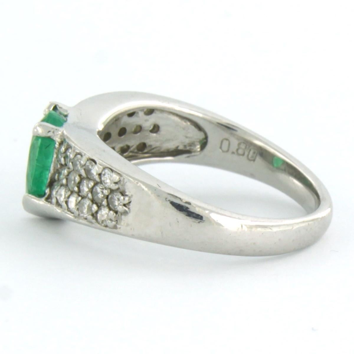 Modern Ring with emerald and diamonds 900 Platinum For Sale