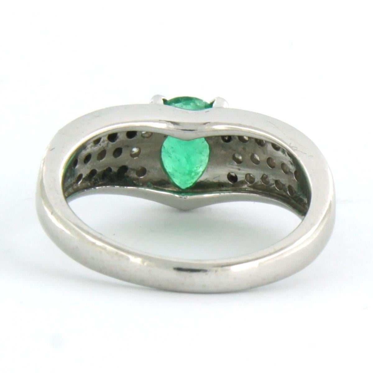 Brilliant Cut Ring with emerald and diamonds 900 Platinum For Sale