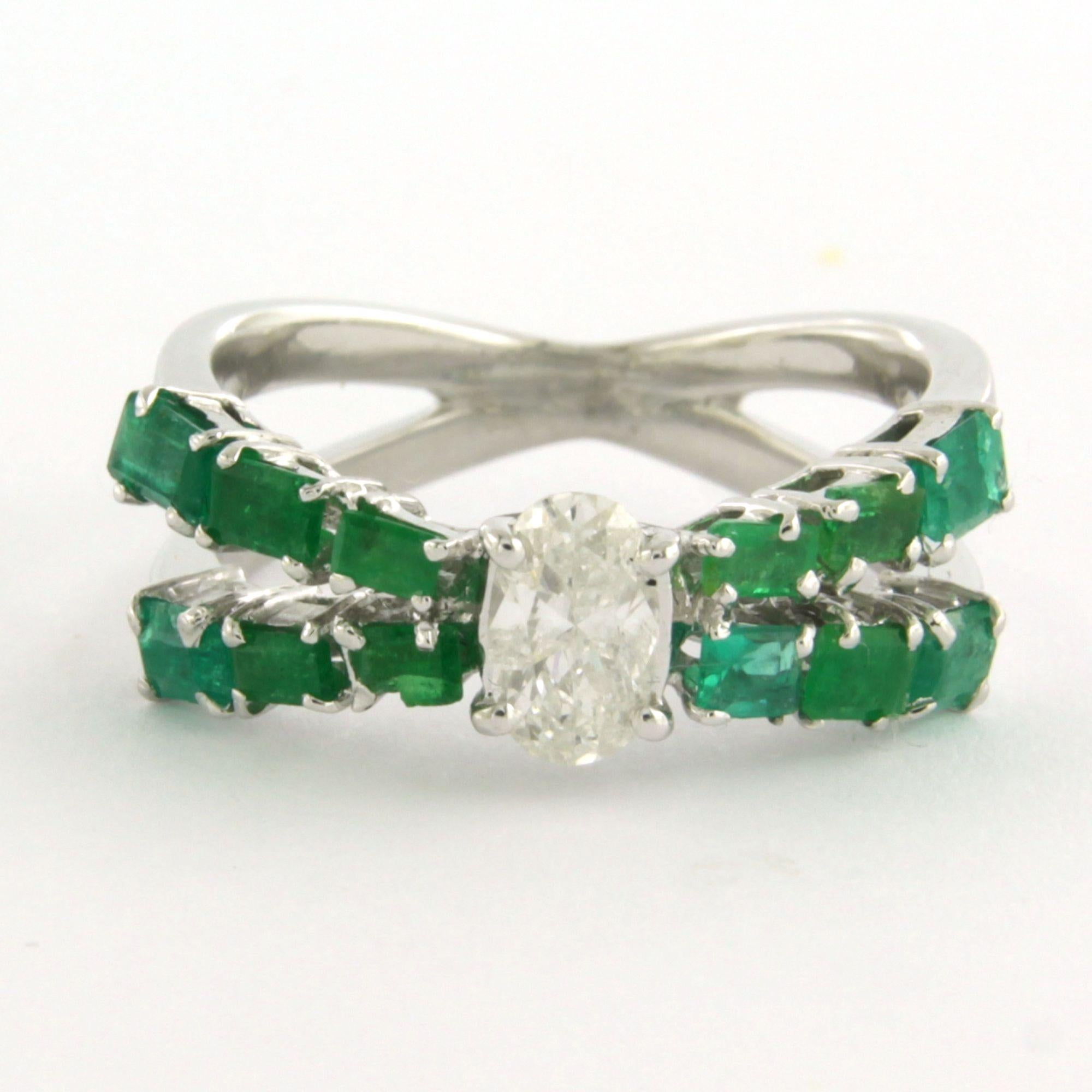 18k white gold ring set with a central oval-cut diamond up to 0.50 ct – F/G – Pique 1 and emerald up to 1.20 ct – ring size US 3.75 - EU 14.75 (46)

Detailed description:

The top of the ring is 6.1 mm wide and 5.4 mm high.

Ring size US 3.75 - EU
