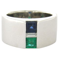 Ring with emerald, sapphire and baguette shaped diamond up to 0.20ct platinum