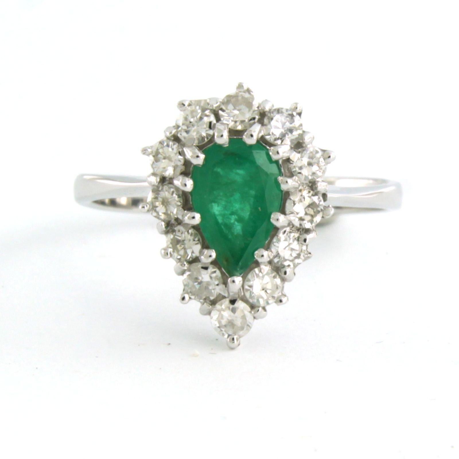 14k white gold ring set with emerald total approximately 1.00ct and brilliant cut diamonds up to 0.50ct - F/G - SI - ring size US 6 - EU 16.5 (52)

detailed description:

The top of the ring is in a drop shape of 1.5 cm by 1.1 cm wide and 6.7 mm