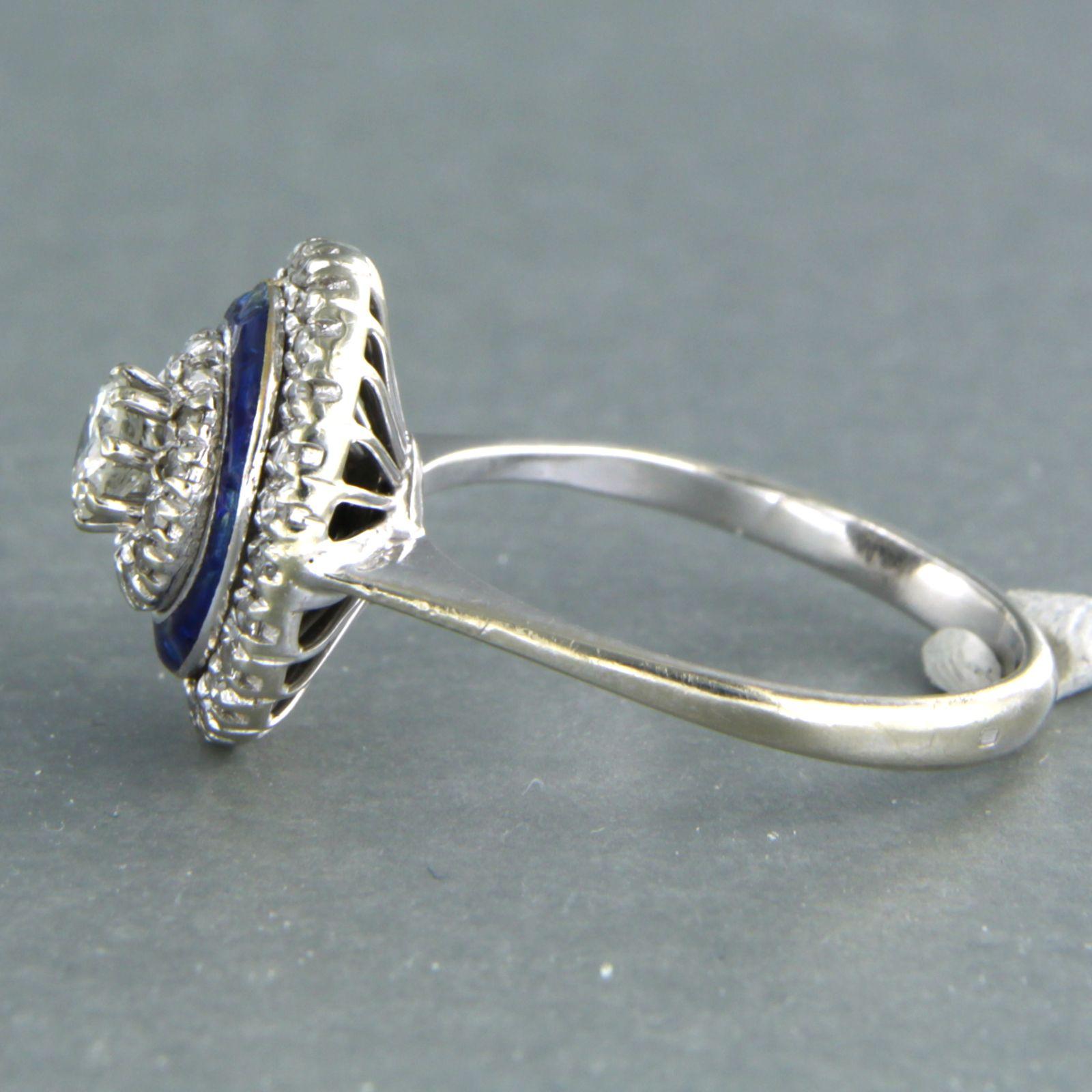 18k white gold ring set with enamel and brilliant and single cut diamond up to 0.23ct/0.27ct F/G - VS/SI - ring size U.S. 7.25 - EU. 17.5 (55)

detailed description:

the top of the ring 1.4 cm wide by 9.5 mm high

enamel is slightly damaged

weight