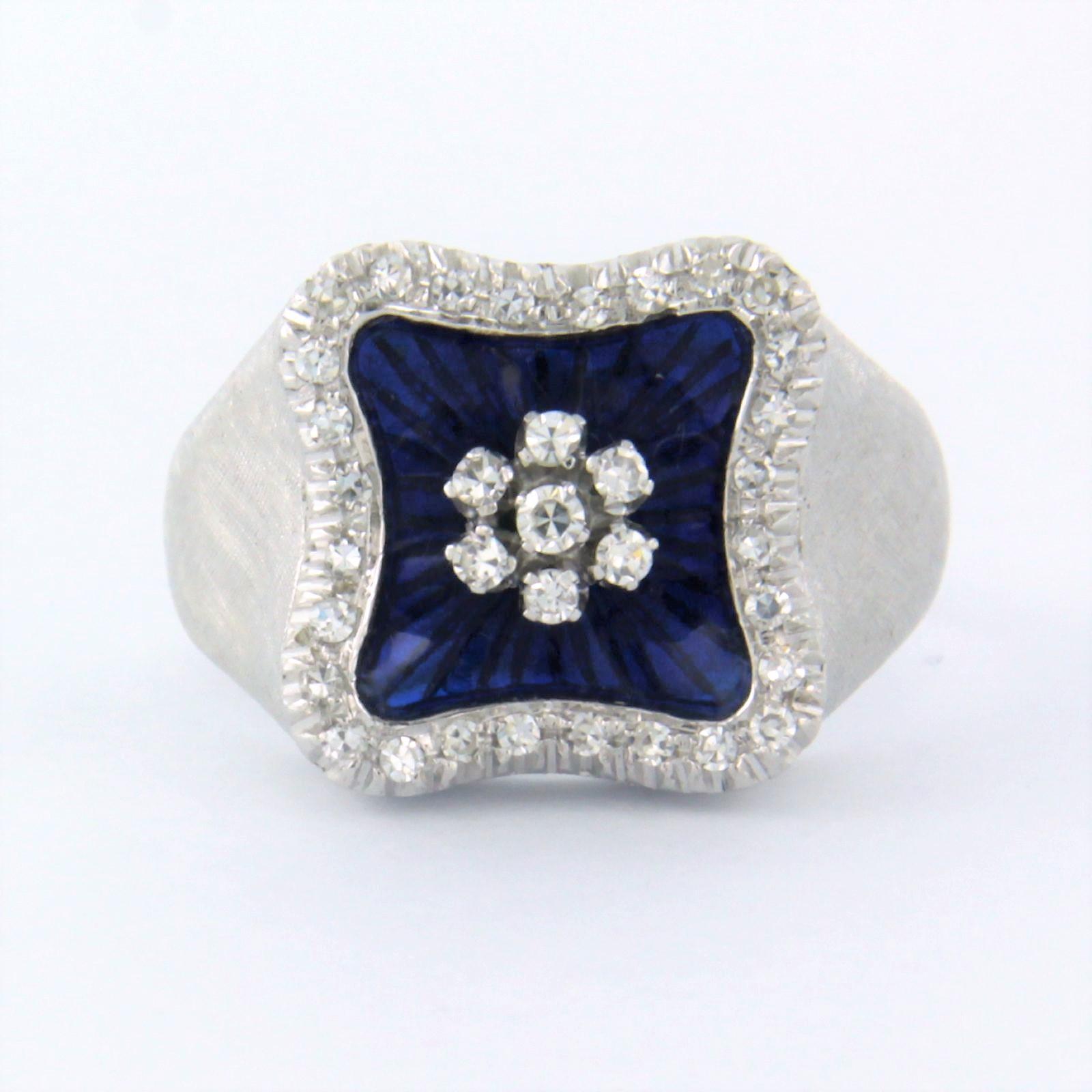 18k white gold ring decorated with blue enamel and set with single cut diamonds. 0.45ct – F/G – VS/SI - ring size U.S. 7.5 – EU. 17.75(56)

detailed description:

The top of the ring is 1.3 cm wide by 5.8 mm high

Ring size US 7.5 – EU. 17.75(56),