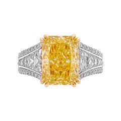 Ring with GIA 5.43ct Fancy Light Yellow Radiant and French cut Side Stones