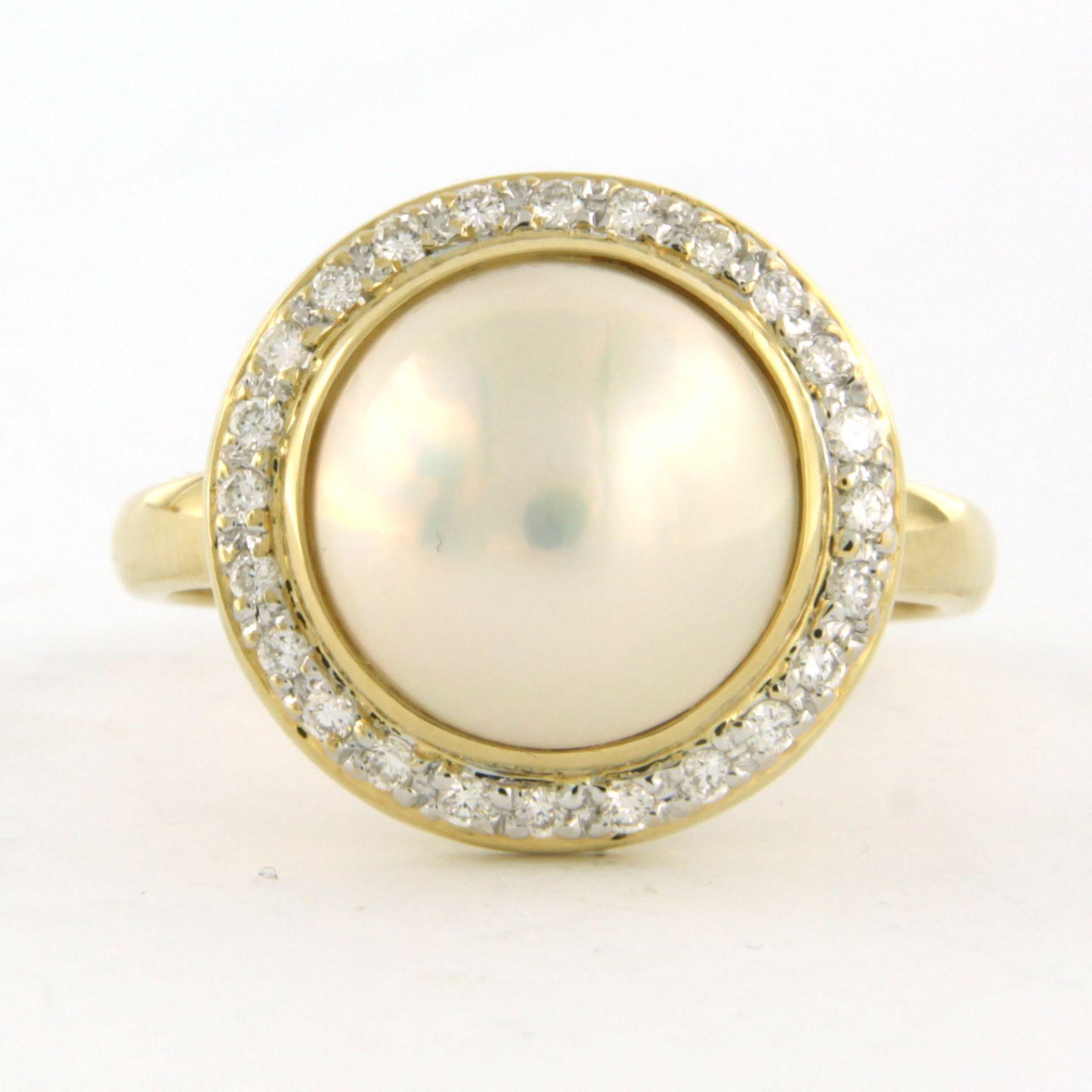 18k bicolour gold ring set with a central mabee pearl and brilliant cut diamonds around it up to 0.40ct - F/G - VS/SI - ring size US 9.25 - EU 19.25(60)

detailed description:

The top of the ring is in a round shape of 1.1 cm wide and 4.0 mm