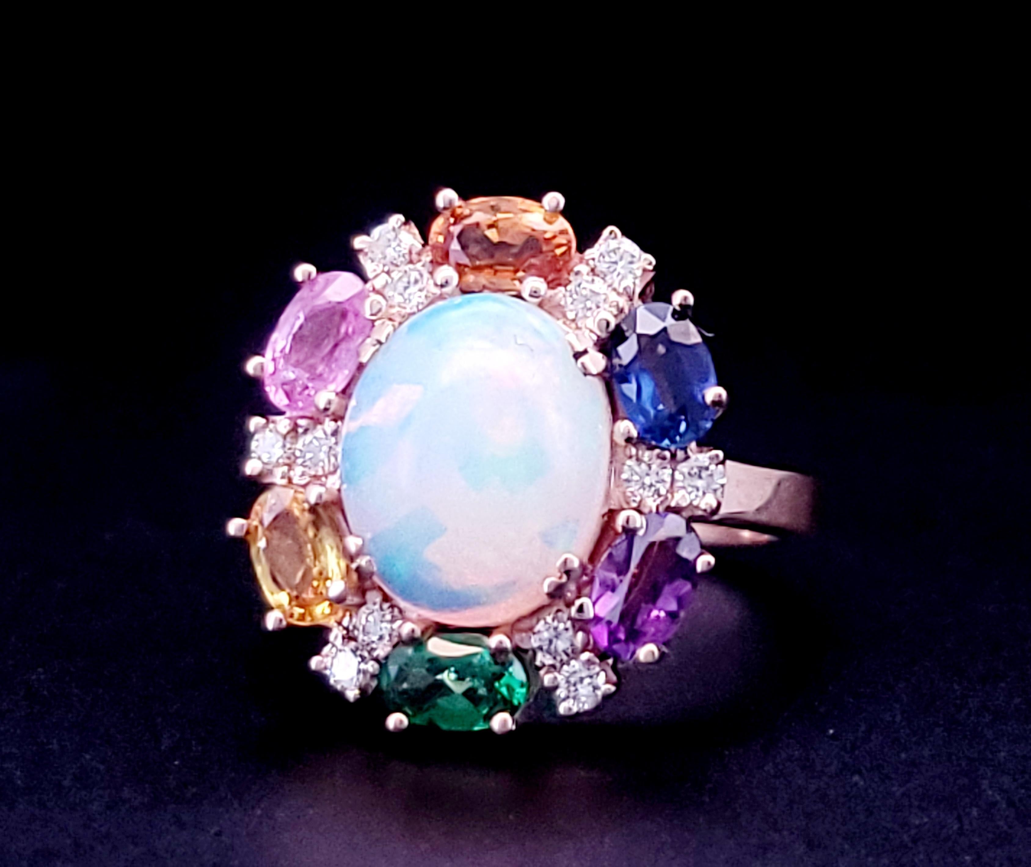 Ring featuring 1 7/8cts. Neapolitan Opal, 1/3cts. Blueberry Sapphire, 1/4cts, Yellow sapphire, 1/4cts. Blue Gum Pink Sapphire, 1/5 cts. Dark Amethyst, 1/6cts. Forest Green tsavorite, 1/6cts. nude Diamonds set in 14K Rose Gold

Material Type : 14K