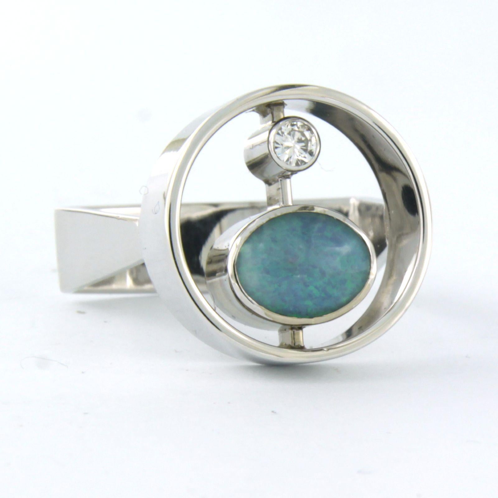14k white gold ring set with opal and brilliant cut diamonds. 0.08ct - F/G - VS/SI - ring size U.S. 8 - EU. 18.25(57)

detailed description:

the top of the ring is 1.8 cm wide by 7.7 mm high

Ring size US 8 - EU. 18.25(57), ring can be enlarged or