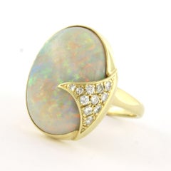 Anello con opale e diamanti taglio brillante fino a 0,30ct in oro 14k 11,0 grammi