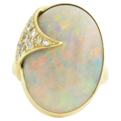 Ring with opal and brilliant cut diamonds up to 0.30ct 14k yellow gold
