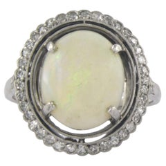 Ring with opal and diamonds 14k white gold