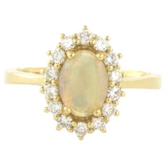 Ring with opal and diamonds 18k yellow gold