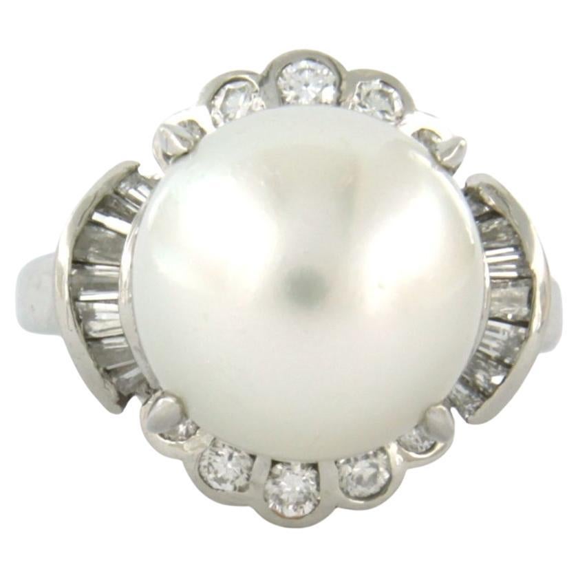 Anillo con perla y diamantes talla brillante y cónica hasta 0,51ct platino