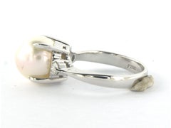 Anillo con perla y diamantes talla brillante hasta 0,14ct 5,6 gramos platino