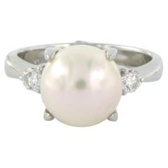 Ring with pearl and brilliant cut diamonds up to 0.14ct 5.6 grams platinum