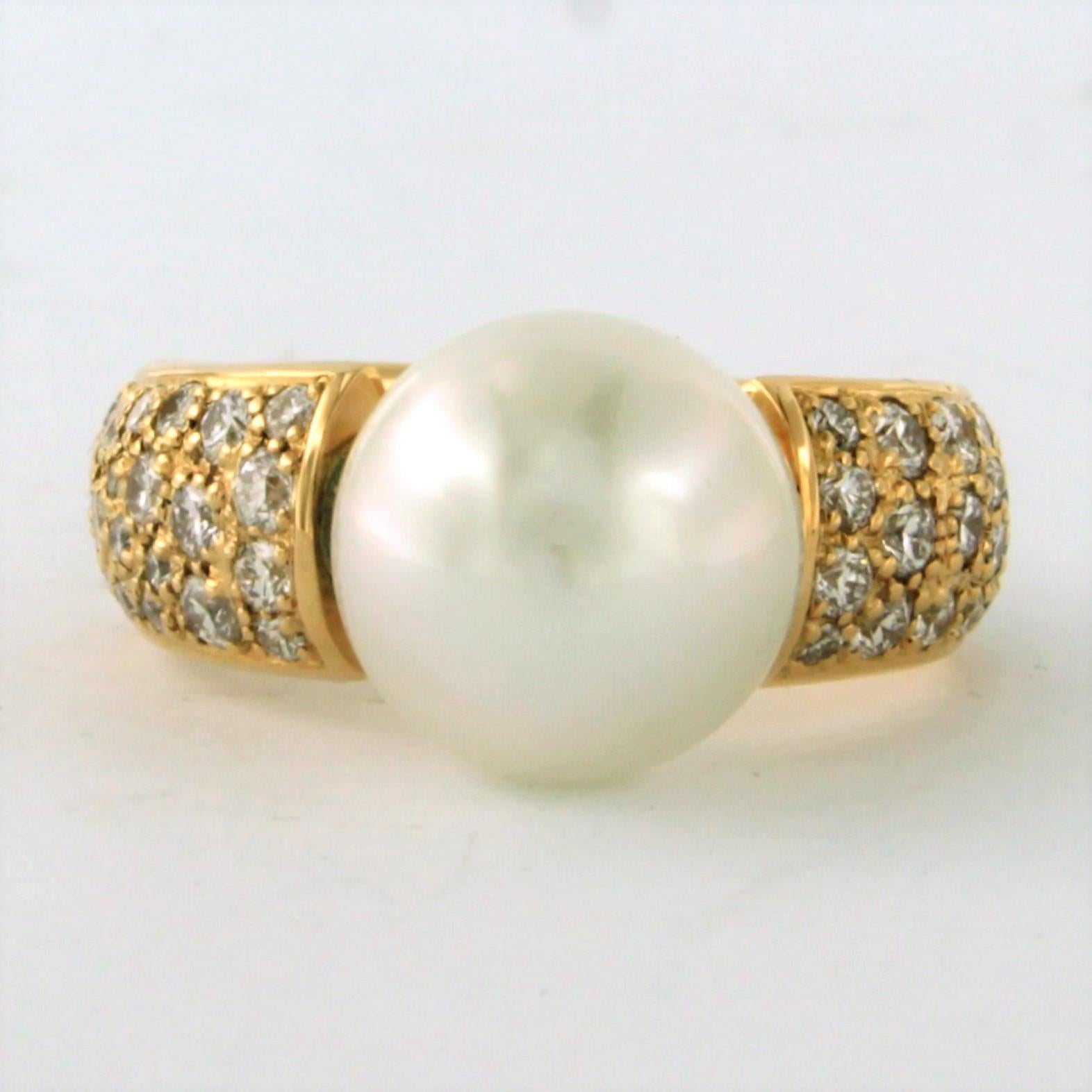 Bague en or jaune 18k sertie d'une perle et de diamants taille brillant 1.10ct - F/G - VS/SI - taille de bague U.S. 7.25 - EU 17.5(55)

description détaillée :

Le haut de l'anneau mesure 1,15 cm de large et 1,15 cm de haut.

Taille de la bague : US