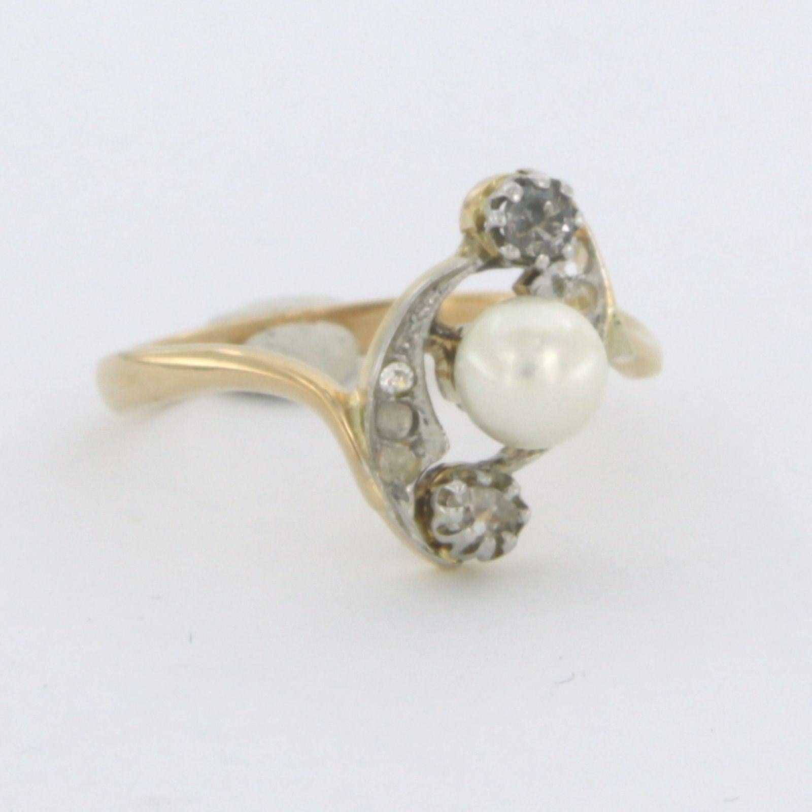 18k bicolour gold ring with pearl and rose cut diamond 0.10ct G/H - SI - ring size US. 7.5 - EU. 17.75 (56)

detailed description

the top of the ring is 1.4 cm wide and 7.5 mm high

Ring size US 7.5 - EU. 17.75 (56), ring can be enlarged or reduced