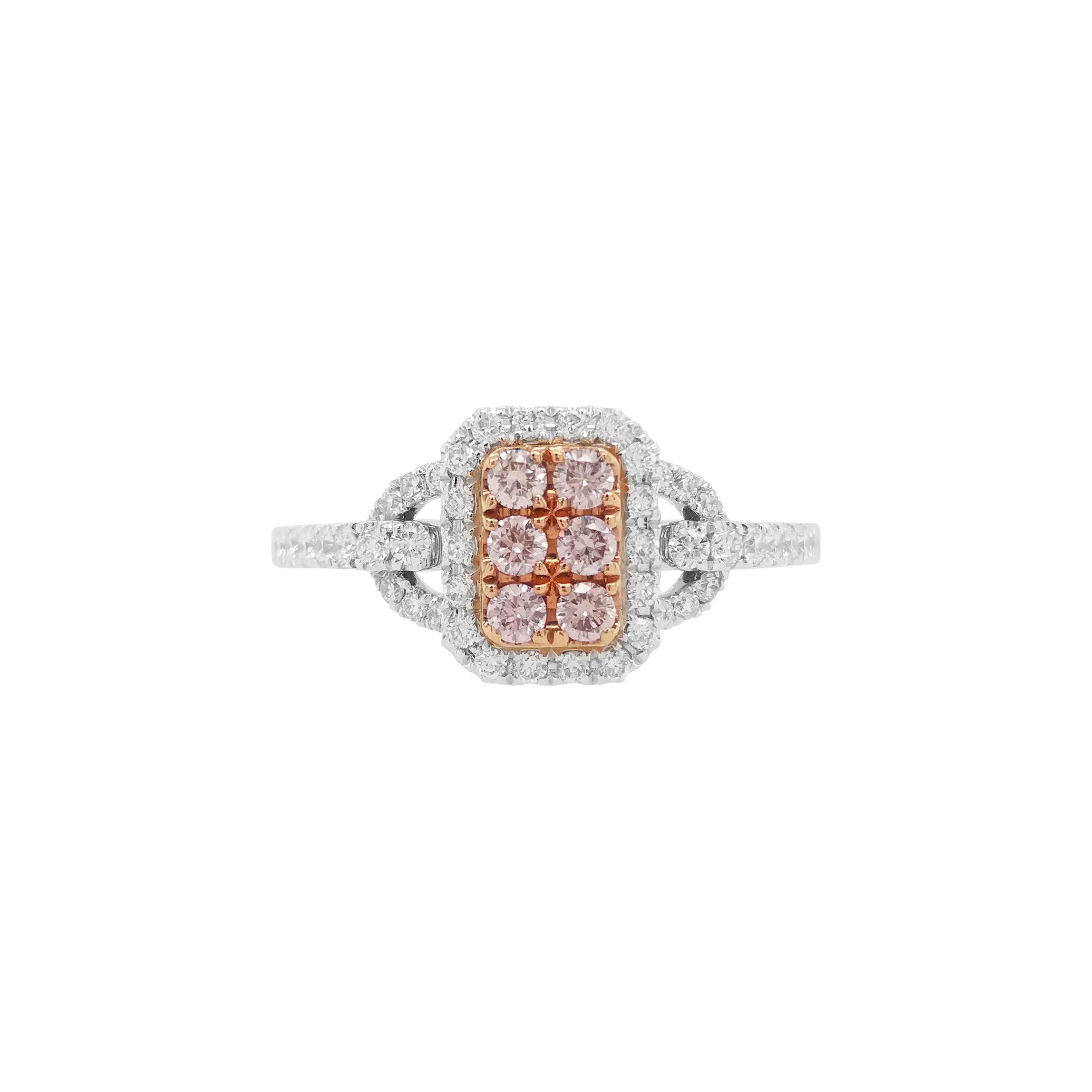 Elegant and delicately designed Ring with Natural Pink diamonds originating from the famed mines of Argyle in Australia and long with White diamonds, set in Platinum and Gold.

Round Brilliant Cut Natural Pink Diamonds - 0.15 cts
Round Brilliant Cut