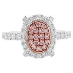 Ring aus 18 Karat Gold und Platin mit rosa Diamanten im Brillantschliff und weißem Diamanten