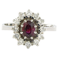 Anello con rubino e diamanti taglio brillante fino a 0,50 carati in oro 14 carati 4,4 grammi