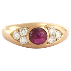 Anello con rubino e diamanti taglio brillante fino a 0,60 carati in oro rosa 14 carati 6,1 grammi