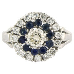 Ring with sapphire and brillient cut diamonds up to 0.85ct 14k white gold