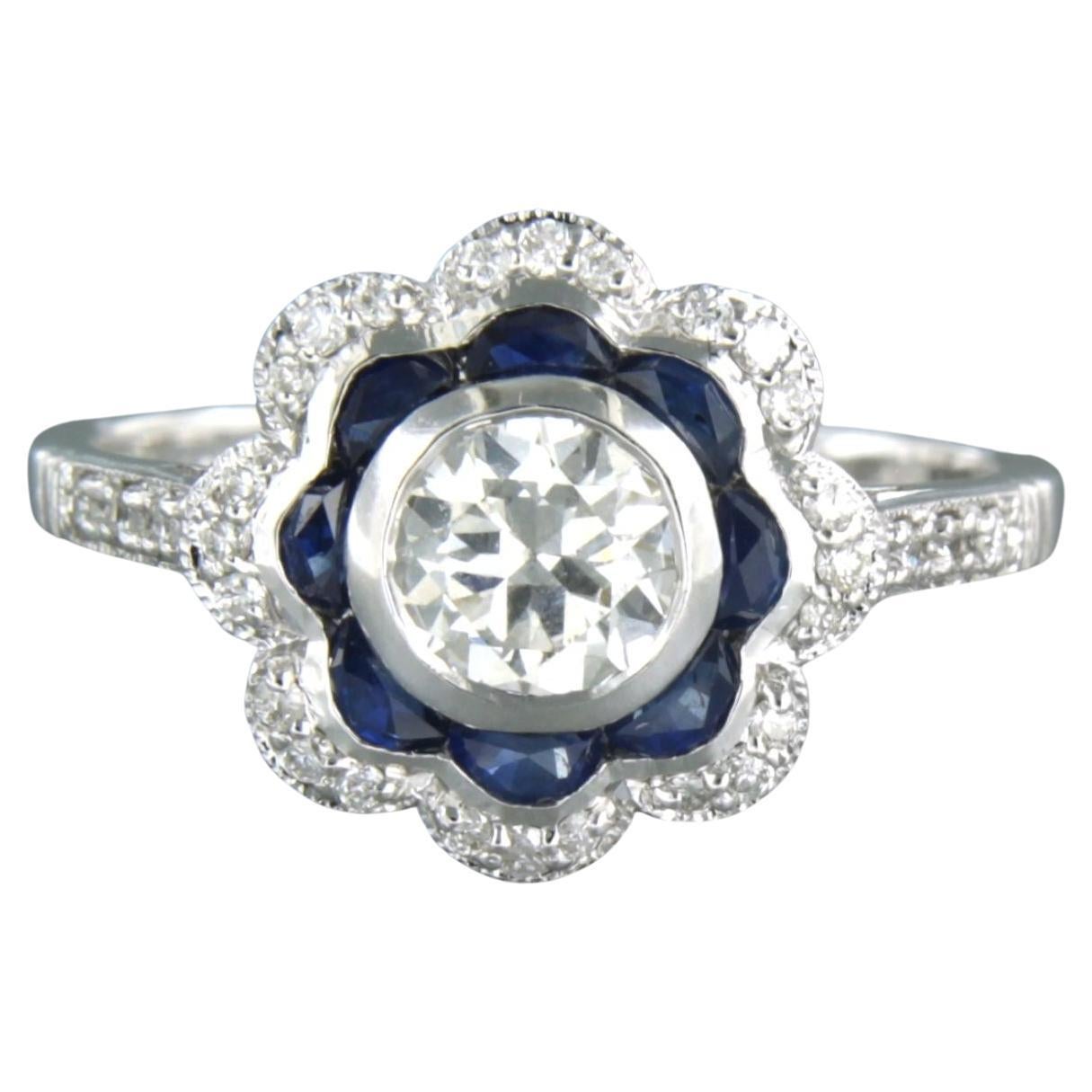 Ring aus 14 Karat Weißgold mit Saphiren und Diamanten