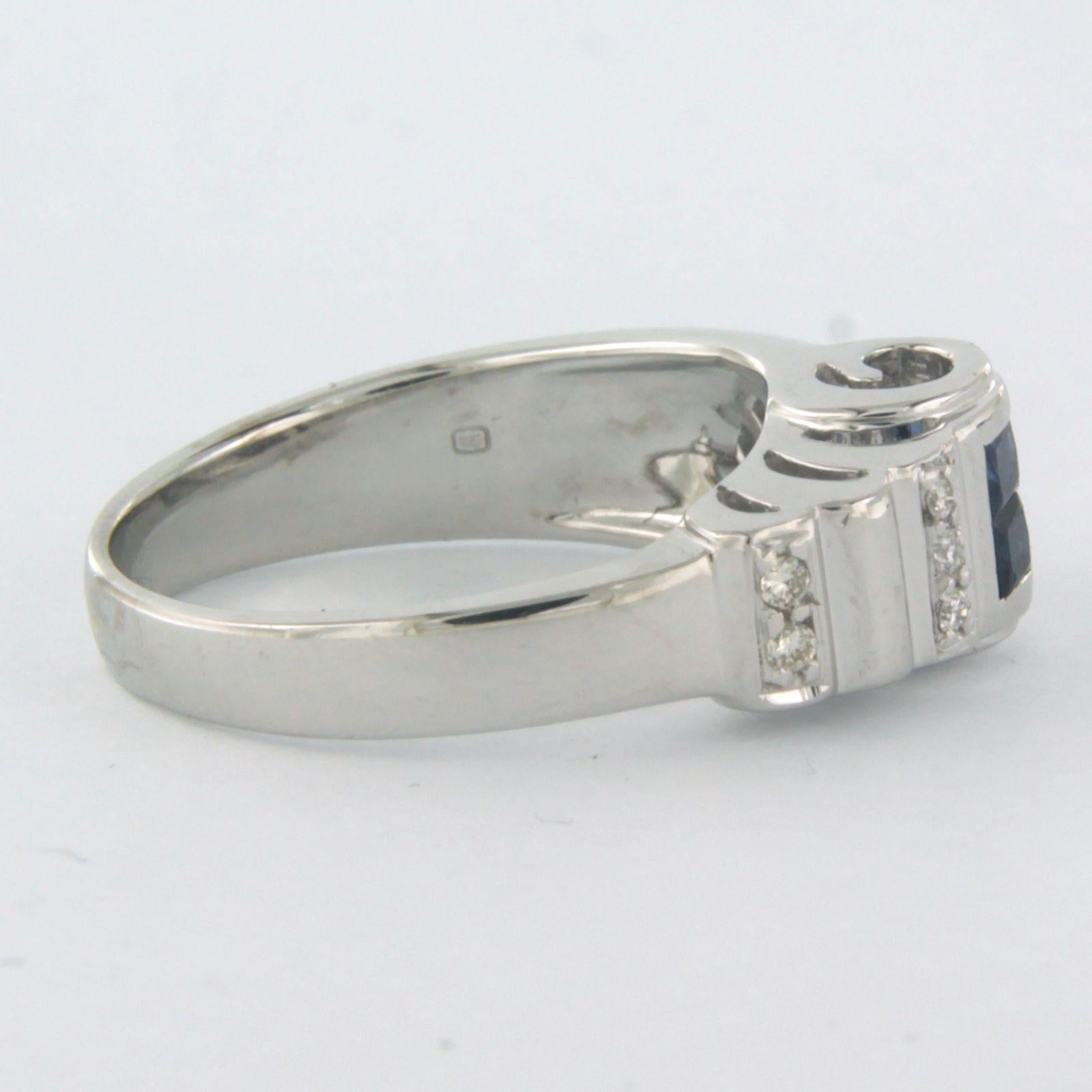 Ring aus 18 Karat Weißgold, besetzt mit Saphiren und Diamanten im Prinzess- und Brillantschliff. 0.20ct - F/G - VS/SI - Ringgröße U.S. 7 - EU. 17.25 (54)

detaillierte Beschreibung:

Die Oberseite des Rings ist 7,7 mm breit und 6,6 mm