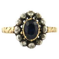 Ring with sapphire and rose cut diamonds up to 0.15ct 14k yellow gold and silver