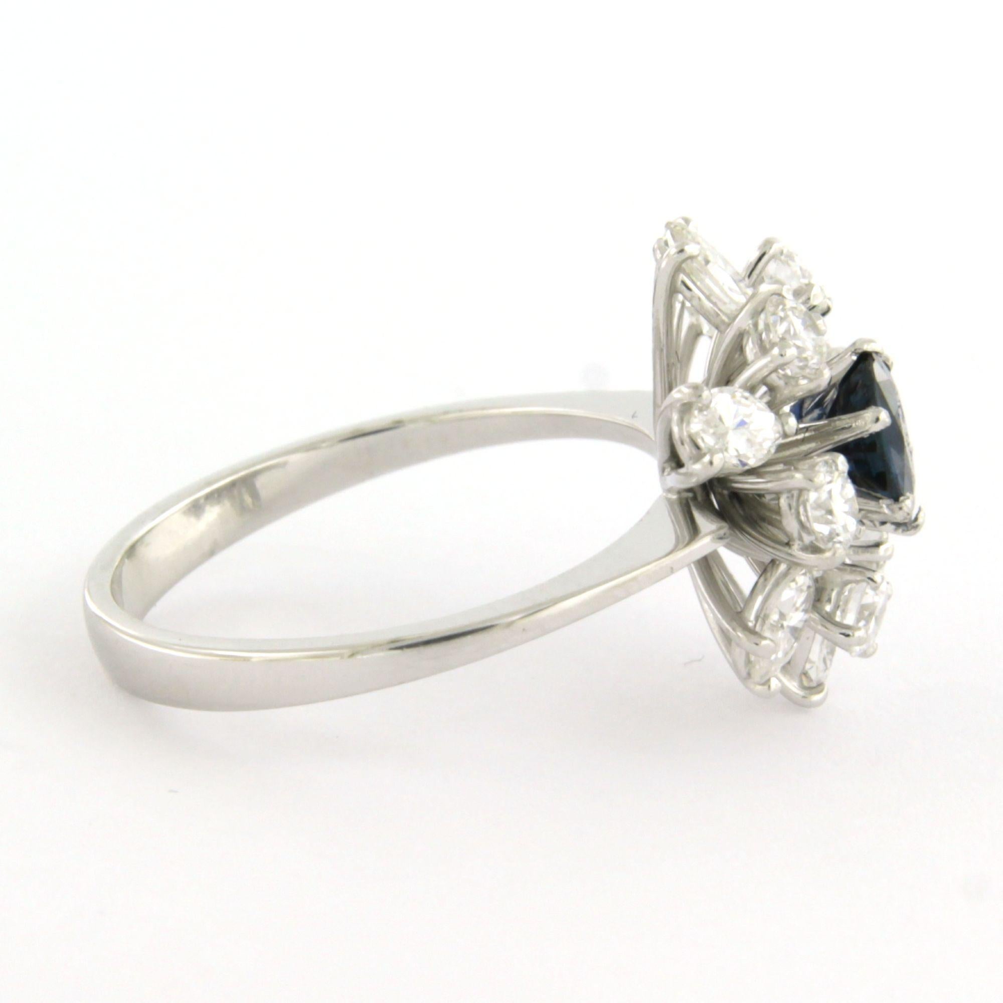 18k white gold ring set with a central sapphire up to 0.80 ct, marquise-shaped, and a brilliant-cut diamond up to 1.30 ct - F/G - VS/SI - ring size US 7.25 - EU 17.5(55)

Detailed description:

The top of the ring is 1.6 cm wide and 7.7 mm