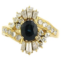 Ring with sapphire, taper and brilliant cut diamonds up to 0.75ct 18k gold