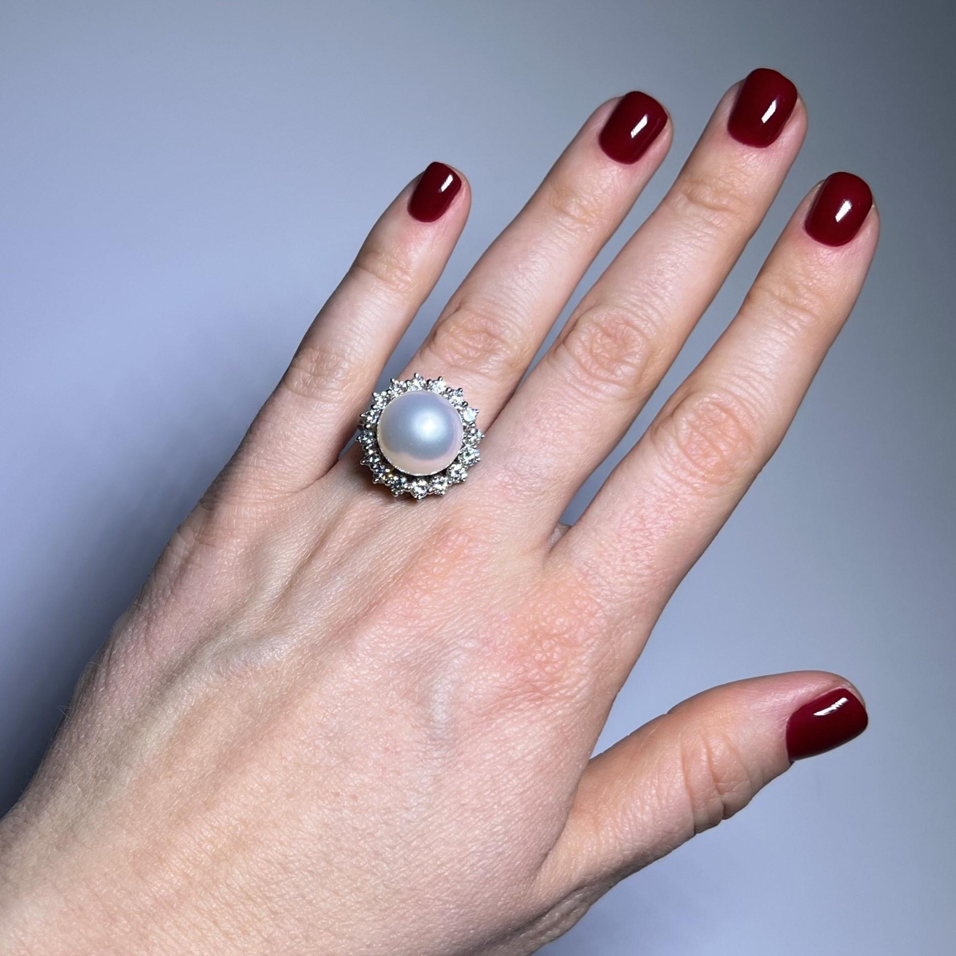 Elevate your elegance with our stunning pearl ring. Designed in 18 Karat white gold, it features a radiant South Sea cultural pearl at its heart, exuding natural charm. Encircled by a halo of 16 brilliant-cut diamonds totaling 0.96 carats,