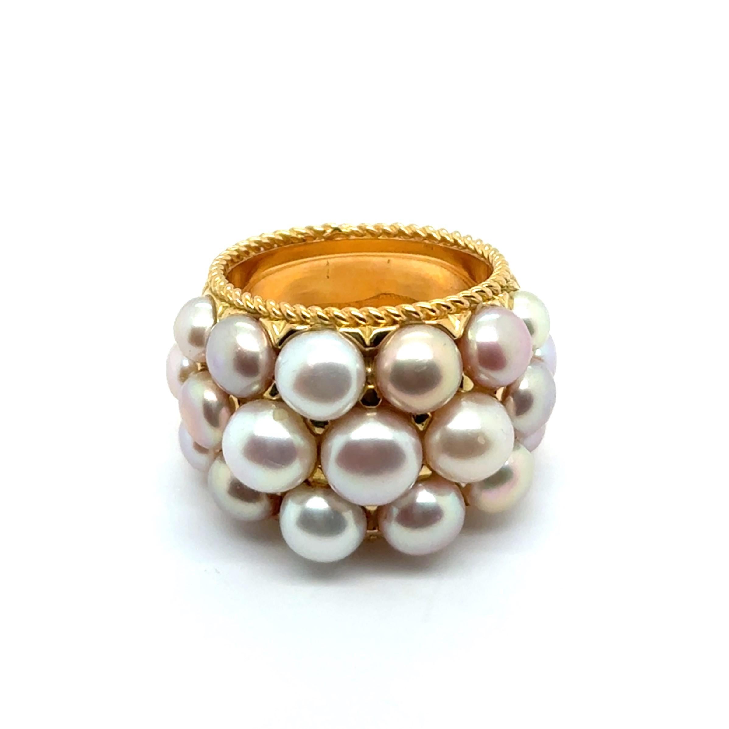 This enchanting ring by Swiss jeweler Péclard is a masterful dance of elements, where 18-karat yellow gold wraps around the finger like sunlight, embracing 19 luminous South Sea pearls. Each pearl glows with a soft, organic luster, creating a poetic